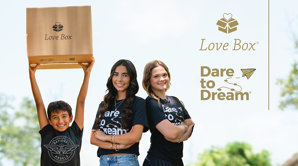 Young people smiling at a camera holding a Love Box.